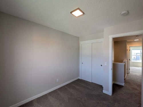 290 Fireside Drive, Cochrane, AB - Indoor Photo Showing Other Room