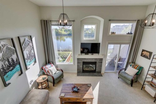 44 Everridge Common Sw, Calgary, AB - Indoor Photo Showing Living Room With Fireplace