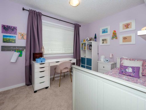 14 Walden Road Se, Calgary, AB - Indoor Photo Showing Bedroom