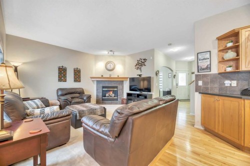408 Rainbow Falls Way, Chestermere, AB - Indoor Photo Showing Living Room With Fireplace