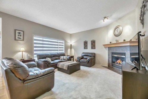 408 Rainbow Falls Way, Chestermere, AB - Indoor Photo Showing Living Room With Fireplace