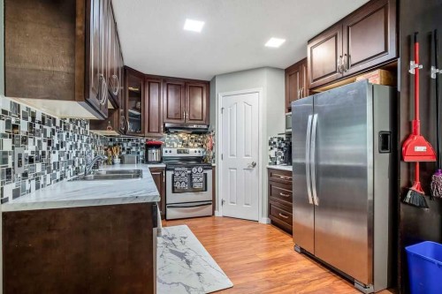 1926/1928 32 Street Sw, Calgary, AB - Indoor Photo Showing Kitchen With Double Sink