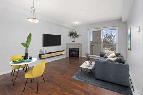 1203-333 Taravista Drive Ne, Calgary, AB - Indoor Photo Showing Living Room With Fireplace