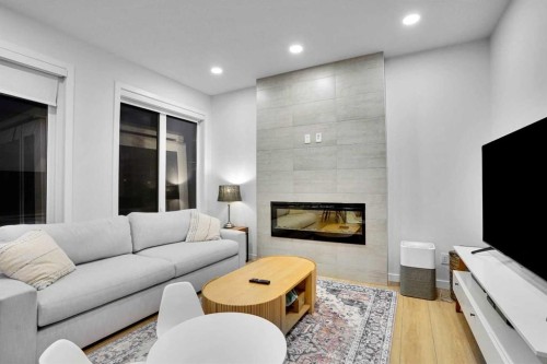 88 Magnolia Crescent Se, Calgary, AB - Indoor Photo Showing Living Room With Fireplace