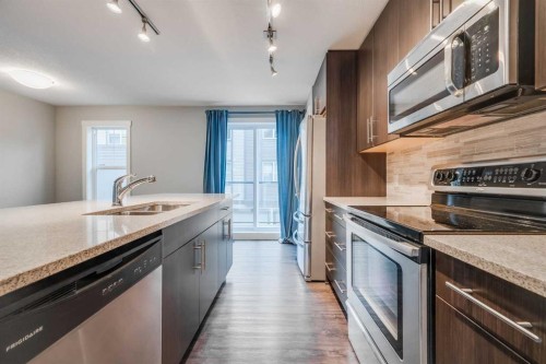 534 Mckenzie Towne Drive Se, Calgary, AB - Indoor Photo Showing Kitchen With Stainless Steel Kitchen With Double Sink