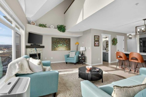 305-141 Mountain Street, Cochrane, AB - Indoor Photo Showing Living Room With Fireplace