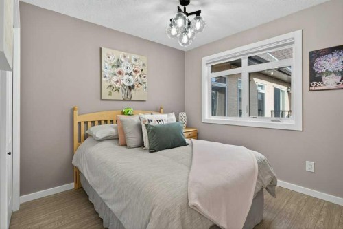 305-141 Mountain Street, Cochrane, AB - Indoor Photo Showing Bedroom