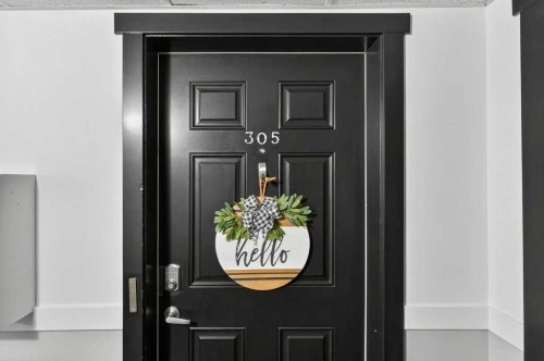 305-141 Mountain Street, Cochrane, AB - Indoor Photo Showing Other Room