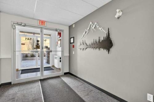 305-141 Mountain Street, Cochrane, AB - Indoor Photo Showing Other Room