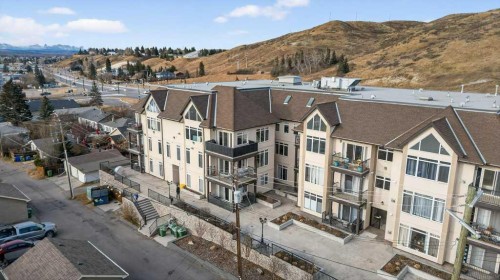 305-141 Mountain Street, Cochrane, AB - Outdoor With Balcony