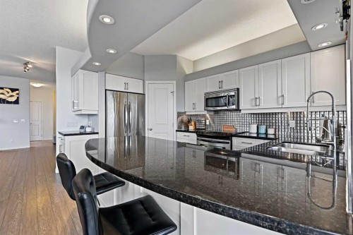1-5616 14 Avenue Sw, Calgary, AB - Indoor Photo Showing Kitchen With Stainless Steel Kitchen With Double Sink With Upgraded Kitchen