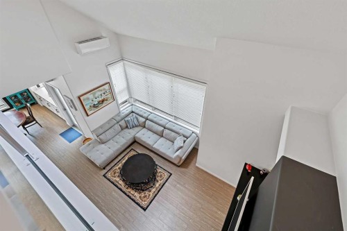 1-5616 14 Avenue Sw, Calgary, AB - Indoor Photo Showing Other Room With Fireplace