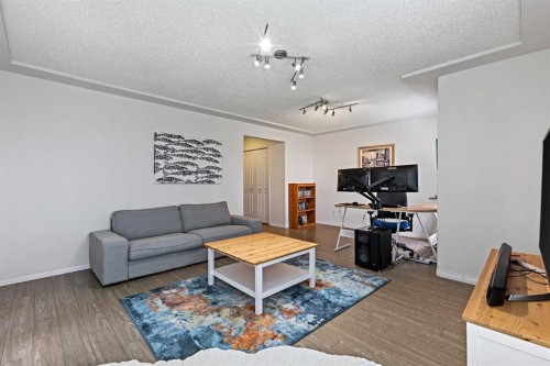 1-5616 14 Avenue Sw, Calgary, AB - Indoor Photo Showing Living Room