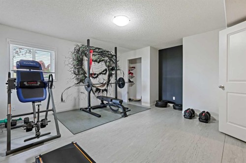 1-5616 14 Avenue Sw, Calgary, AB - Indoor Photo Showing Gym Room