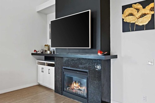 1-5616 14 Avenue Sw, Calgary, AB - Indoor With Fireplace