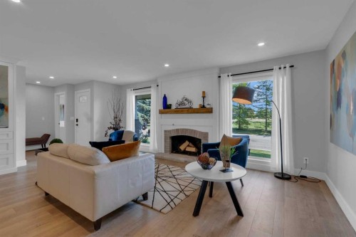 39 Midpark Close Se, Calgary, AB - Indoor Photo Showing Living Room With Fireplace