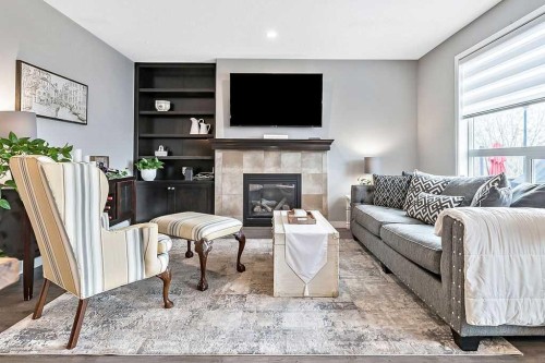 90 Brightoncrest Grove Se, Calgary, AB - Indoor Photo Showing Living Room With Fireplace
