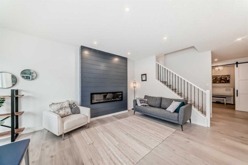 12 West Grove Link Sw, Calgary, AB - Indoor Photo Showing Living Room With Fireplace