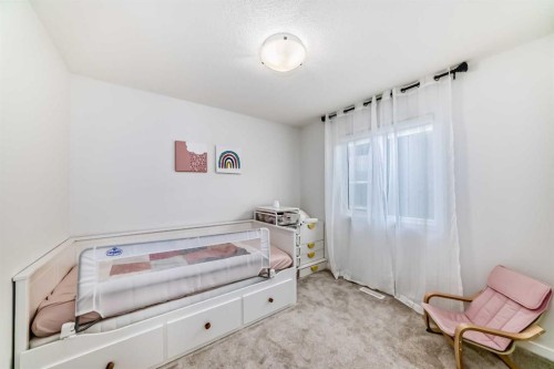 12 West Grove Link Sw, Calgary, AB - Indoor Photo Showing Bedroom