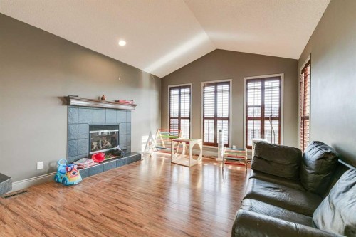 79 Prestwick Street Se, Calgary, AB - Indoor Photo Showing Living Room With Fireplace