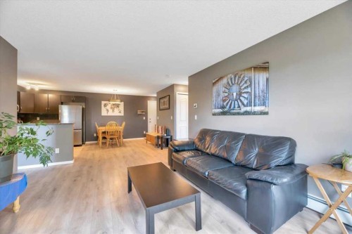 2308-60 Panatella Street Nw, Calgary, AB - Indoor Photo Showing Living Room