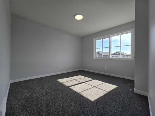 512 Baywater Manor Sw, Airdrie, AB - Indoor Photo Showing Other Room