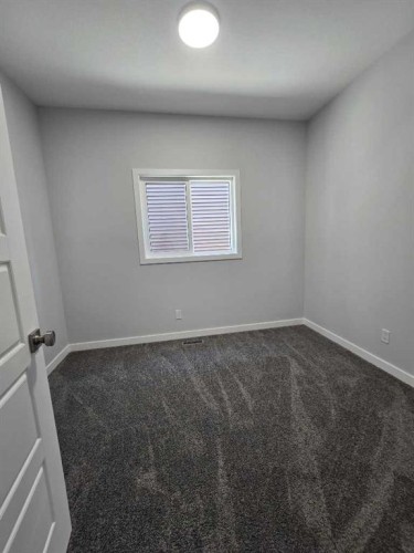 512 Baywater Manor Sw, Airdrie, AB - Indoor Photo Showing Other Room