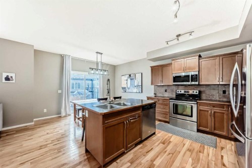 284 Sagewood Landing Sw, Airdrie, AB - Indoor Photo Showing Kitchen With Double Sink