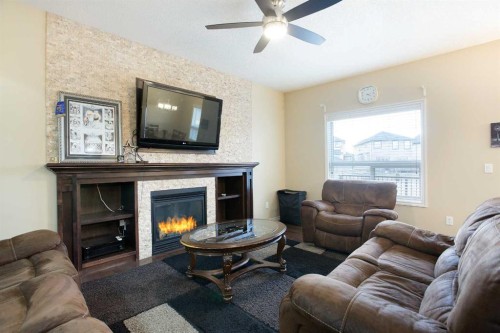 169 Taralake Manor Ne, Calgary, AB - Indoor Photo Showing Living Room With Fireplace