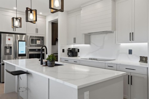 49 Waterford Crescent, Chestermere, AB - Indoor Photo Showing Kitchen With Upgraded Kitchen