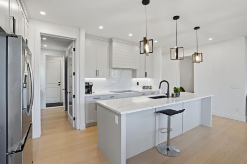 49 Waterford Crescent, Chestermere, AB - Indoor Photo Showing Kitchen With Upgraded Kitchen