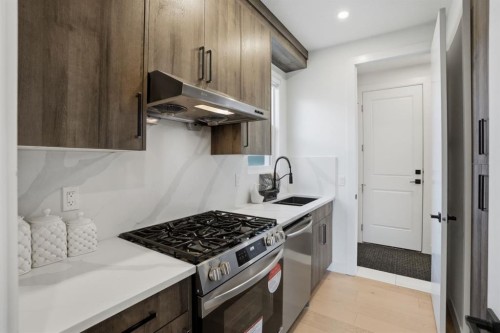 49 Waterford Crescent, Chestermere, AB - Indoor Photo Showing Kitchen With Stainless Steel Kitchen With Upgraded Kitchen