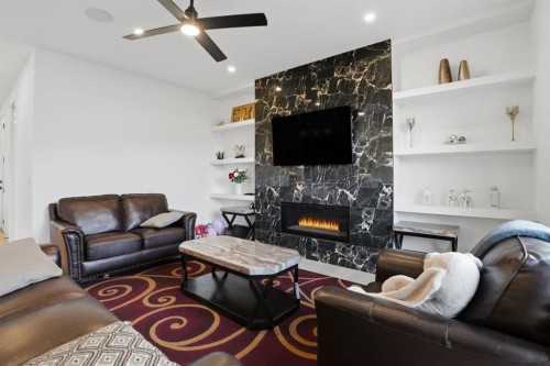 49 Waterford Crescent, Chestermere, AB - Indoor Photo Showing Living Room With Fireplace