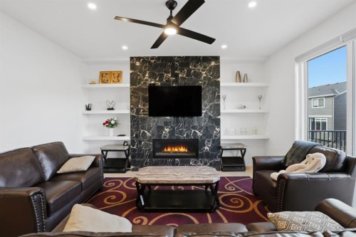 49 Waterford Crescent, Chestermere, AB - Indoor Photo Showing Living Room With Fireplace