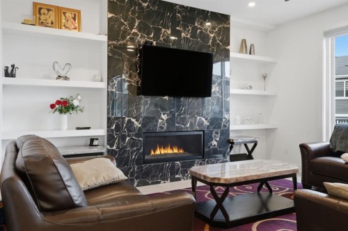 49 Waterford Crescent, Chestermere, AB - Indoor Photo Showing Living Room With Fireplace