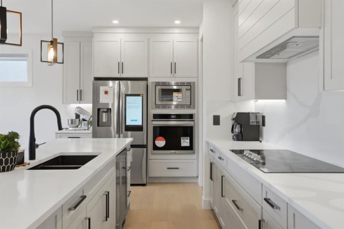 49 Waterford Crescent, Chestermere, AB - Indoor Photo Showing Kitchen With Stainless Steel Kitchen With Double Sink With Upgraded Kitchen
