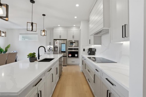 49 Waterford Crescent, Chestermere, AB - Indoor Photo Showing Kitchen With Double Sink With Upgraded Kitchen