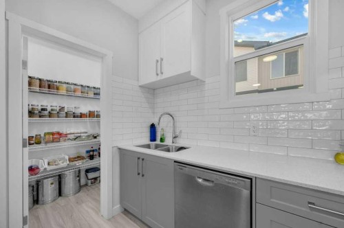 214 Corner Meadows Square, Calgary, AB - Indoor Photo Showing Kitchen With Double Sink