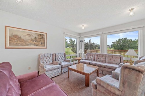 22 Sandarac Circle Nw, Calgary, AB - Indoor Photo Showing Living Room