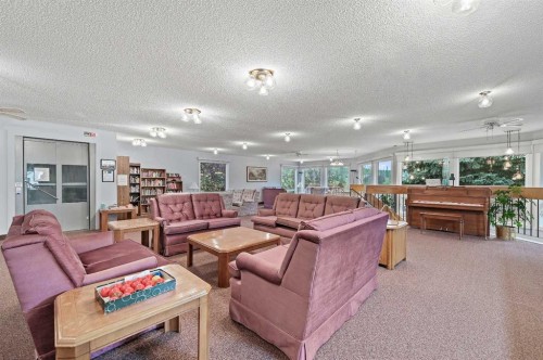 22 Sandarac Circle Nw, Calgary, AB - Indoor Photo Showing Living Room