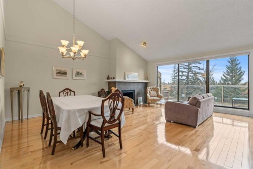 6-1220 Prominence Way Sw, Calgary, AB - Indoor With Fireplace