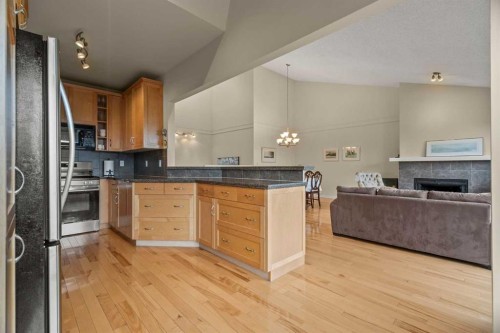 6-1220 Prominence Way Sw, Calgary, AB - Indoor With Fireplace