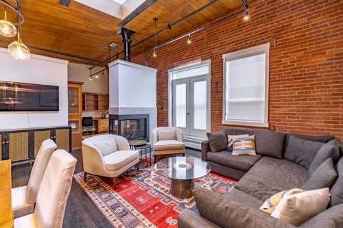 505-535 10 Avenue Sw, Calgary, AB - Indoor Photo Showing Living Room With Fireplace