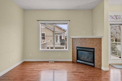 116 Tucker Circle, Okotoks, AB - Indoor Photo Showing Other Room With Fireplace