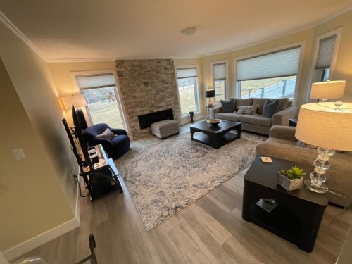 2 Richelieu Court Sw, Calgary, AB - Indoor Photo Showing Living Room With Fireplace