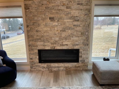 2 Richelieu Court Sw, Calgary, AB - Indoor Photo Showing Living Room With Fireplace