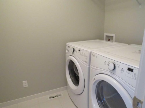 309 Evansridge Park Nw, Calgary, AB - Indoor Photo Showing Laundry Room