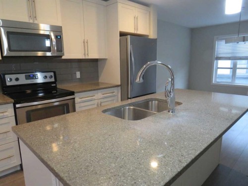 309 Evansridge Park Nw, Calgary, AB - Indoor Photo Showing Kitchen With Stainless Steel Kitchen With Double Sink With Upgraded Kitchen