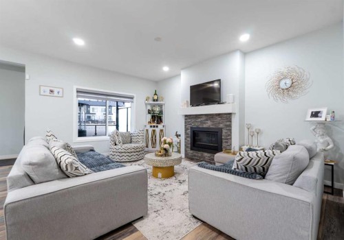 1153 Chinook Gate Bay Sw, Airdrie, AB - Indoor Photo Showing Living Room With Fireplace