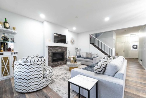 1153 Chinook Gate Bay Sw, Airdrie, AB - Indoor Photo Showing Living Room With Fireplace